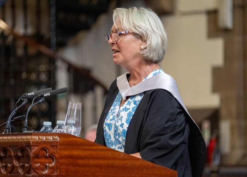 Woman speaking at a lectern