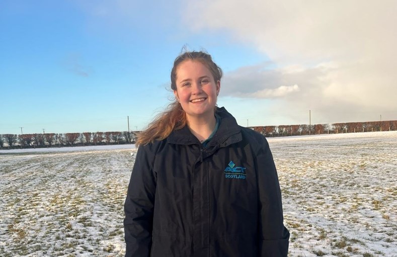 Woman smiling in a snowy paddock