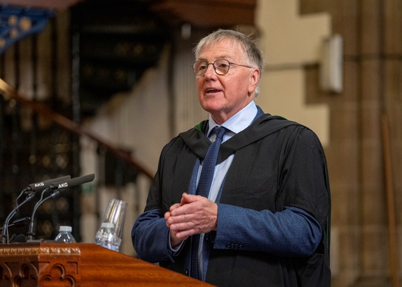 Man speaking at a lectern