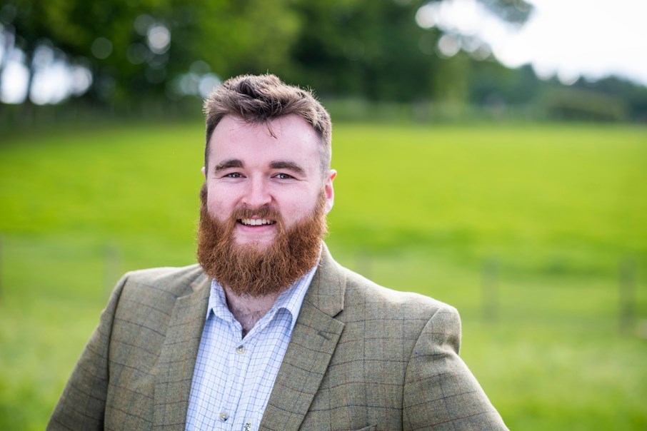 Man smiling in a field