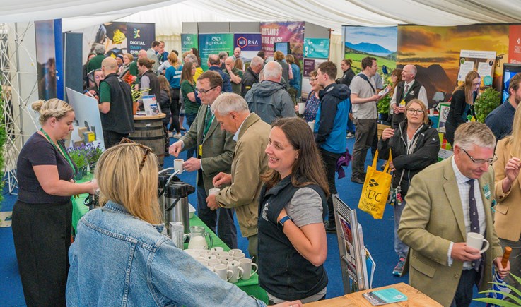 A crowd of people in a marquee